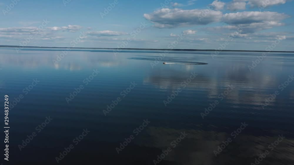 Speedboat quickly floats on the water surface Speedboat quickly floats on the water surface