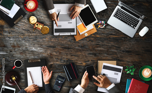 Photography Top view Business and lawyers discussing contract papers with brass scale on desk in office