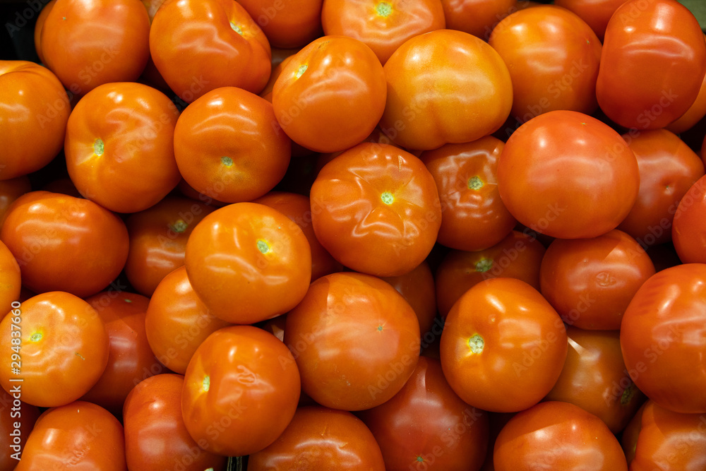 Close-up of mellow red tomatoes on supermarket counter Close-up of mellow red tomatoes on supermarket counter