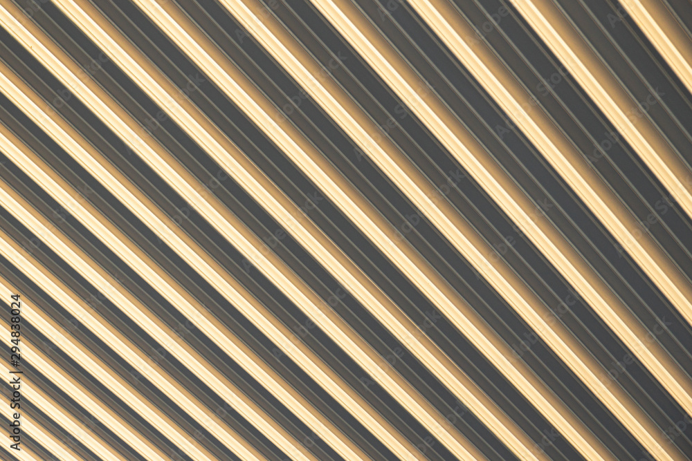 Obraz premium Close-up of beige-grey corrugated surface, eliciting optical illusion