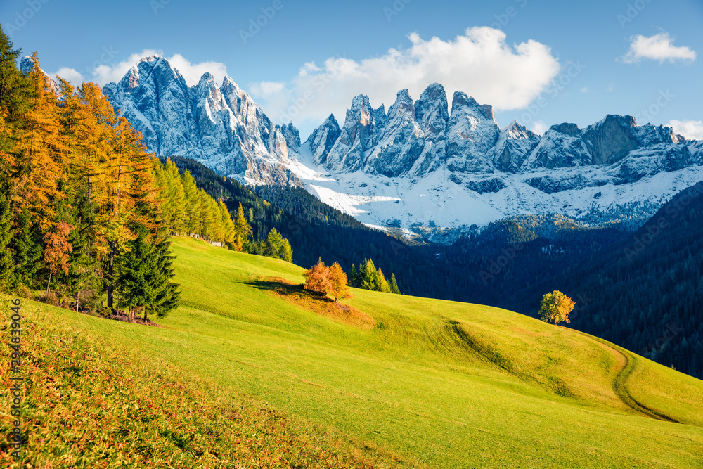 Amazing view of Santa Magdalena village hills in front of the Geisler or Odle Dolomites Group. Breathtaking autumn scene of Dolomite Alps, Italy, Europe. Beauty of countryside concept background.