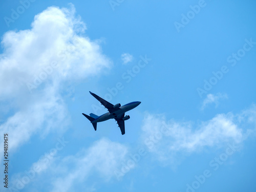 Plane wing land high on blue background