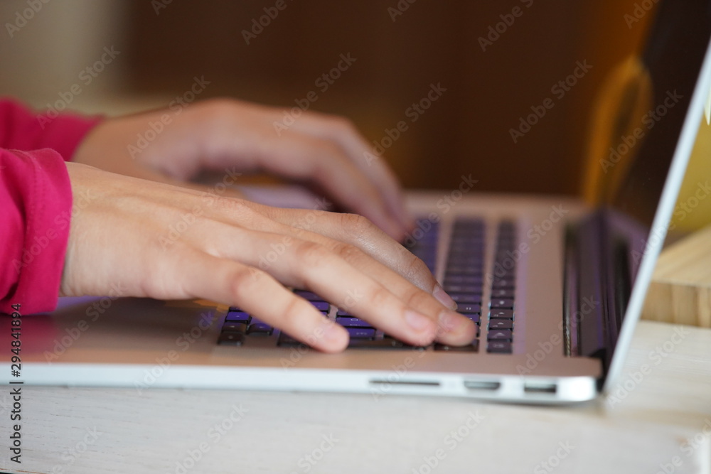 Freelancer working at laptop in caffe Freelancer working at laptop in caffe