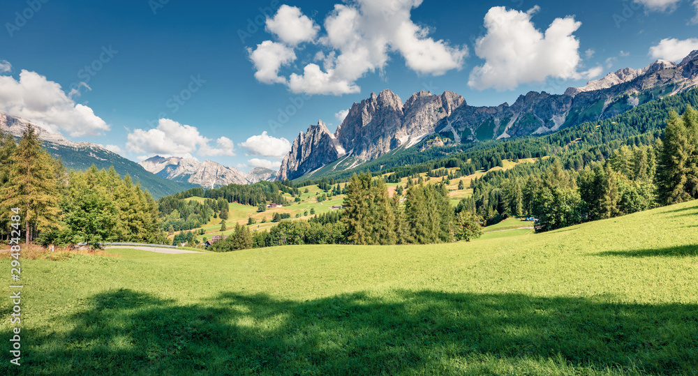 Sunny morning view of Cortina d’Ampezzo resort. Bright summer scene of Dolomiti Alps, Province of Belluno, Italy, Europe. Beauty of countryside concept background.