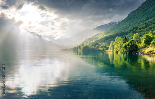 Fantastic summer view of Lovatnet lake  municipality of Stryn  Sogn og Fjordane county  Norway. Colorful rainy scene in Norway. Beauty of nature concept background.