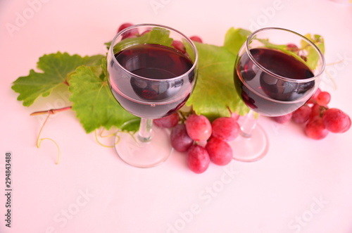 glass of red wine and grapes