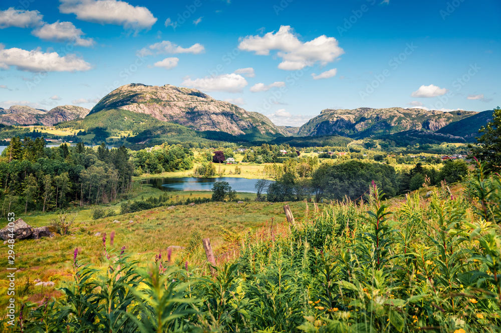 Typical countryside Norwegian landscape. Summy summer morning in Norway, Europe. Beauty of nature concept background. Artistic style post processed photo.