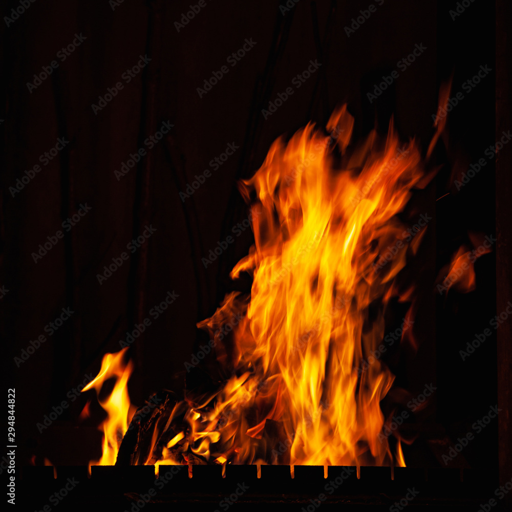 Fire flame. Hot fire burning at night. Bonfire in the barbecue, fireplace and hearth. Fire flame. Hot fire burning at night. Bonfire in the barbecue, fireplace and hearth.