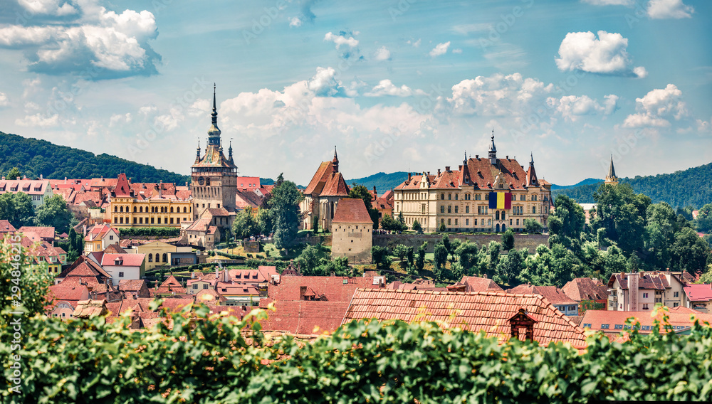 Panoramic morning cityscape of Sighisoara. Splendid summer view of medieval town of Transylvania, Romania, Europe. Traveling concept background.