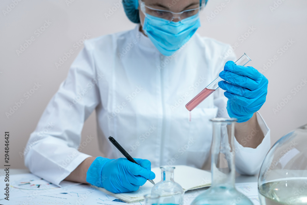 Scientific woman making laboratory research, sitting in office Scientific woman making laboratory research, sitting in office