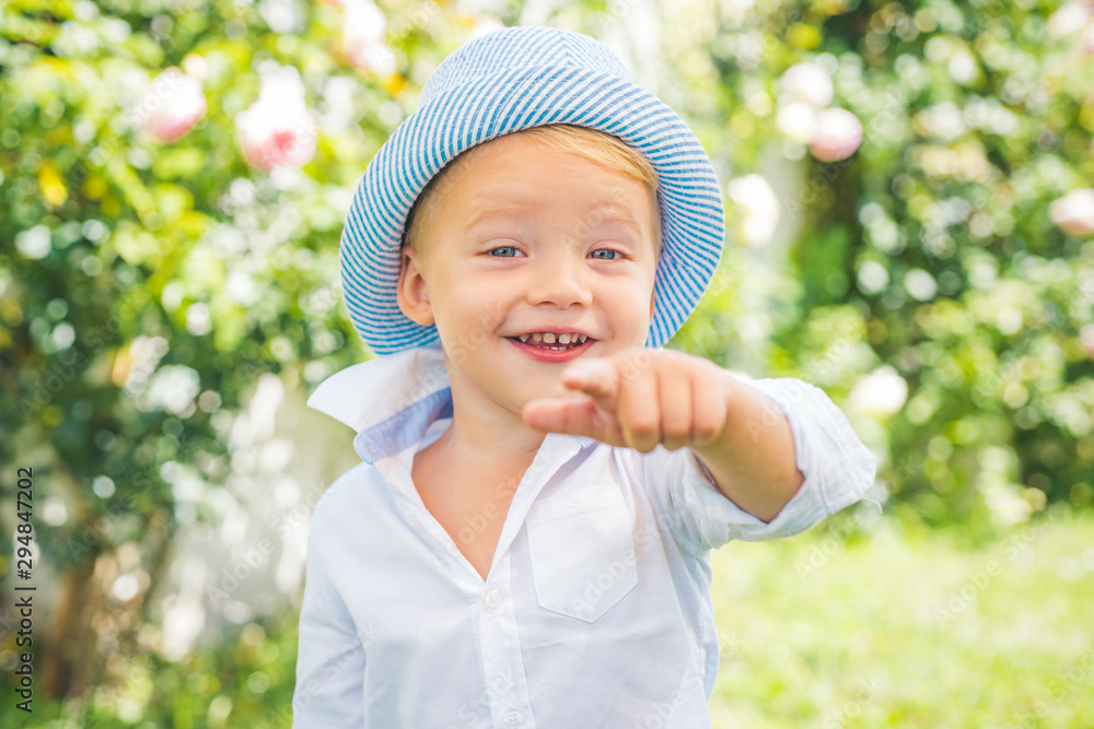 Funny child face. Happy child in summer in nature. Little child enjoy walk. Happy day. Funny child face. Happy child in summer in nature. Little child enjoy walk. Happy day.