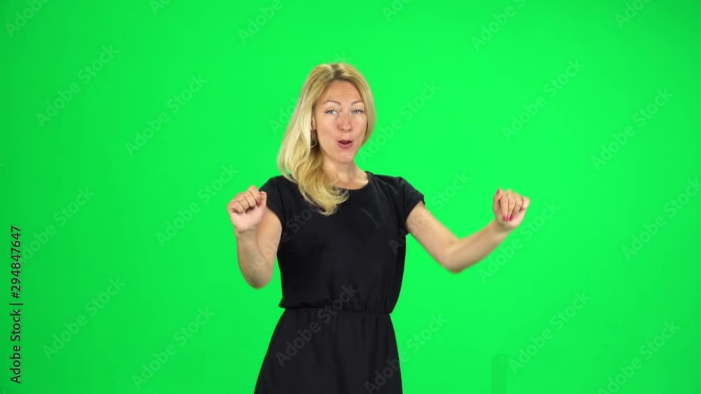 Cheerful girl walking, dancing and waving a hand welcoming. Chroma Key Cheerful girl walking, dancing and waving a hand welcoming. Chroma Key