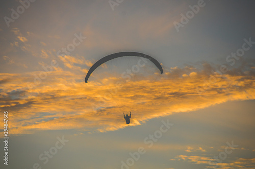 Parachute on sunset over the sea