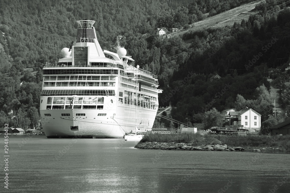 Obraz premium Cruise ship in Norway fiord. Black and white vintage style.