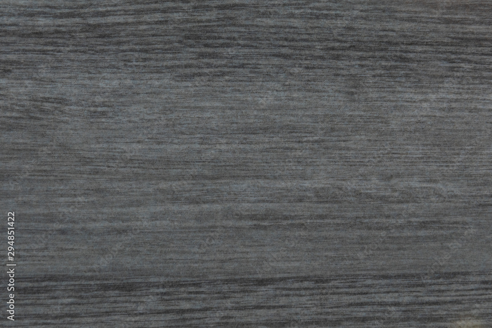 Dark grey wood texture background surface with natural pattern and horizontal strokes. Dark grey wood texture background surface with natural pattern and horizontal strokes.