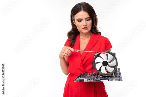 Schilderij op canvas confused brunette with computer part in hands, equipment repair, amateur