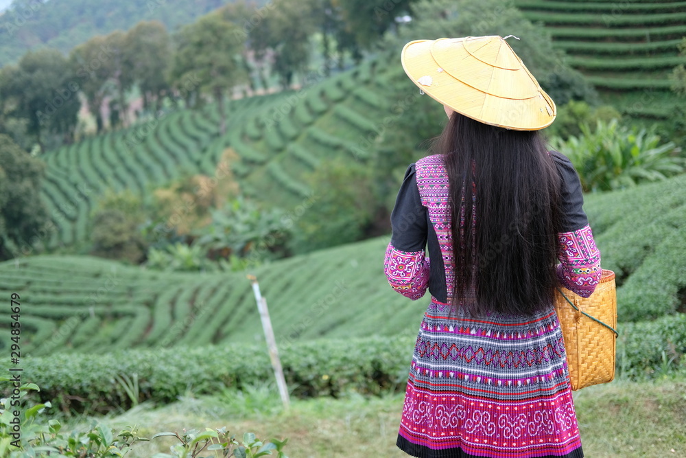 woman with basket of tea plantation