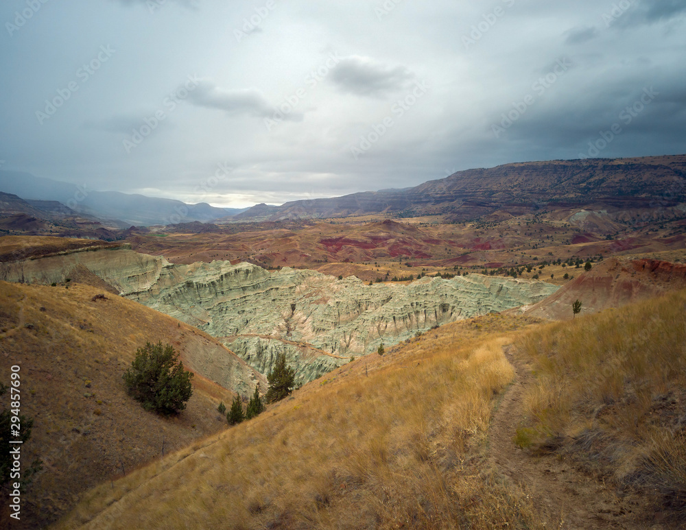 Breathtaking views of the grey-blue badlands and the John Day river valley from the Blue Basin Overlook Trail at the John Day Fossil Beds in Kimberly Oregon