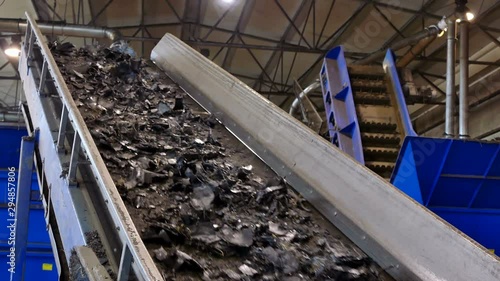 Tire Recycling and Processing / Conveyor belt with cut pieces of recycling tires