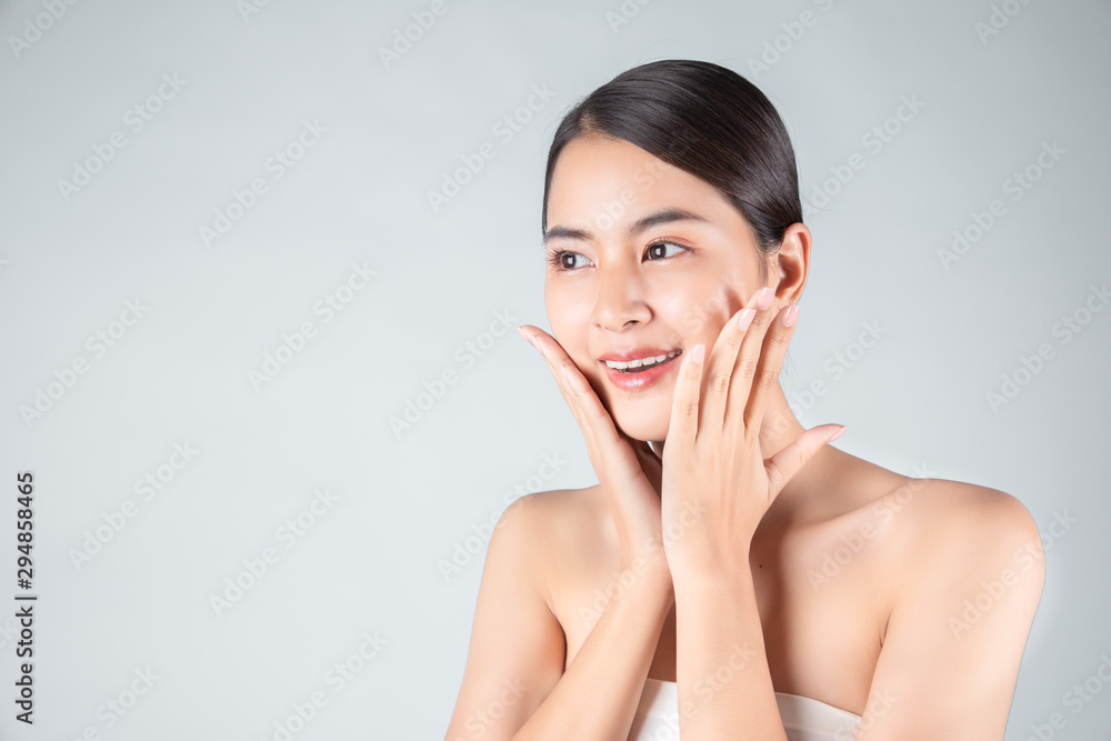Portrait of Beautiful Skin care woman enjoy and happy,touching her face,isolated with clipping path Portrait of Beautiful Skin care woman enjoy and happy,touching her face,isolated with clipping path