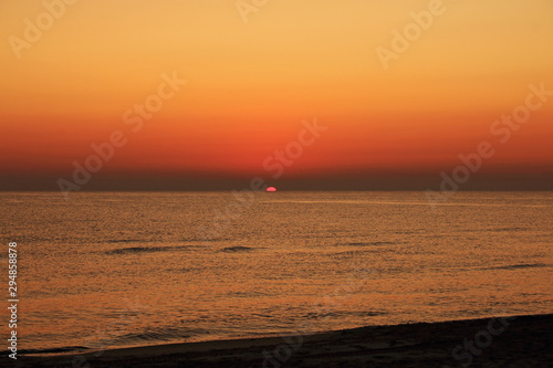 Orange sunrise on the beach