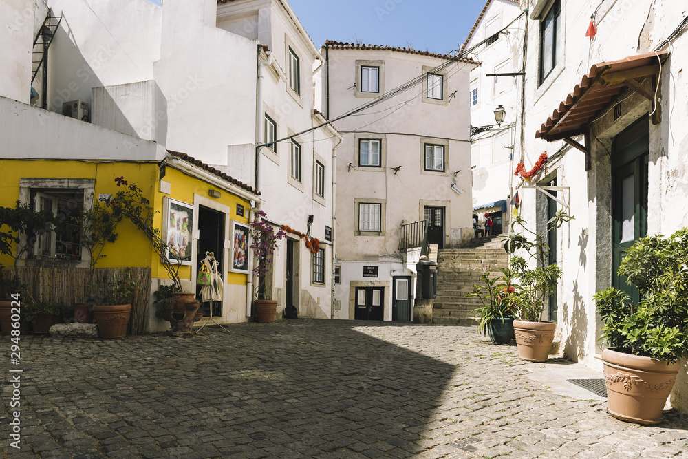 typical portuguese cobblestone street in Lisbon
