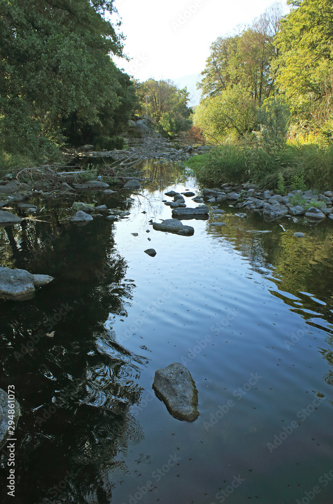 Natural landscape and reflections in river Natural landscape and reflections in river