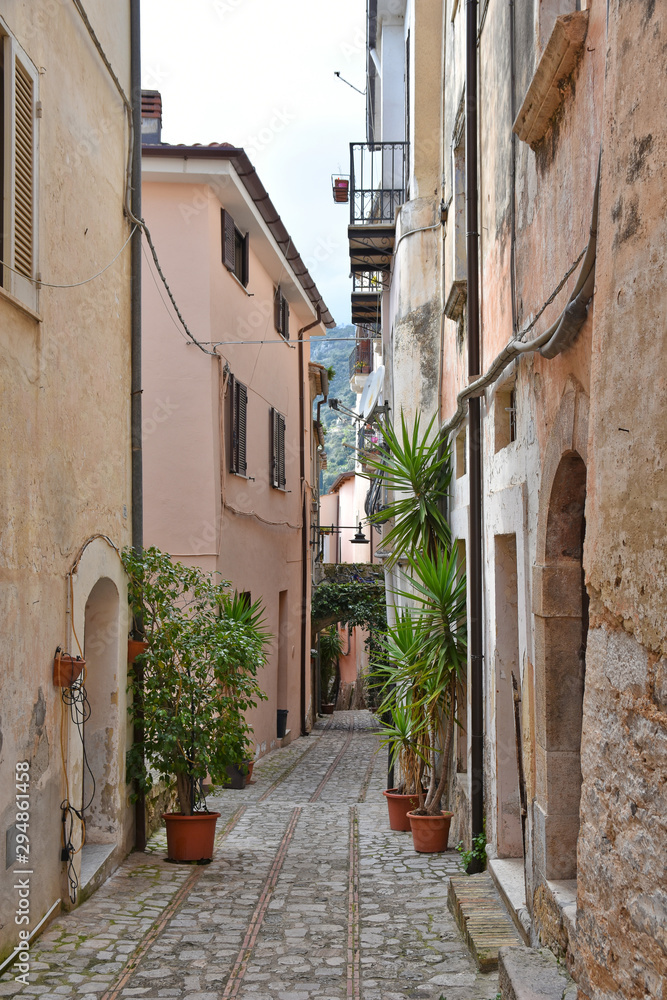 Fototapeta Monte San Biagio, Italy, 03/24/2018. A street among the old houses of a village in the Lazio region.