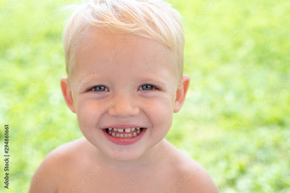 Portrait of happy smiling child boy on nature background. International childrens day. Portrait of happy smiling child boy on nature background. International childrens day.
