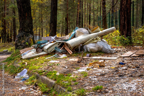 garbage dump in spruce forest photo