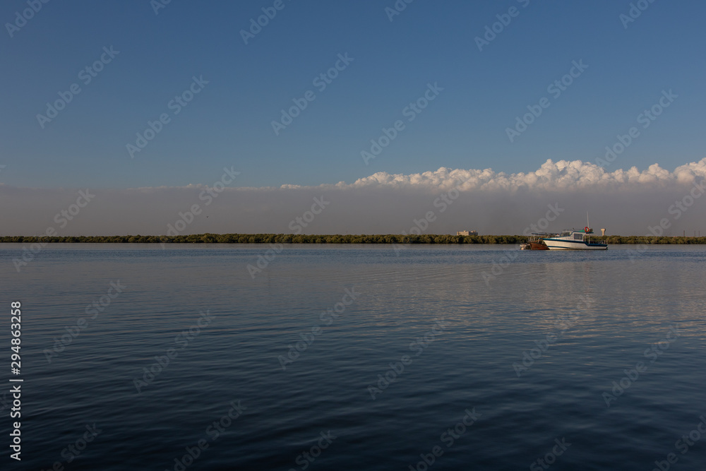Boats in lake and blue sky
