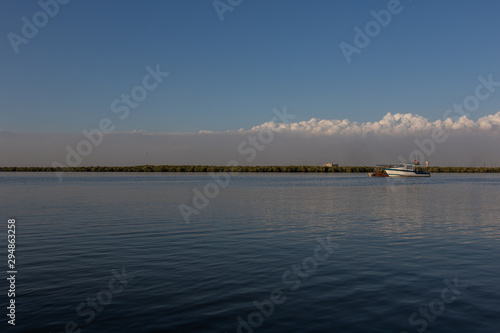 Boats in lake and blue sky