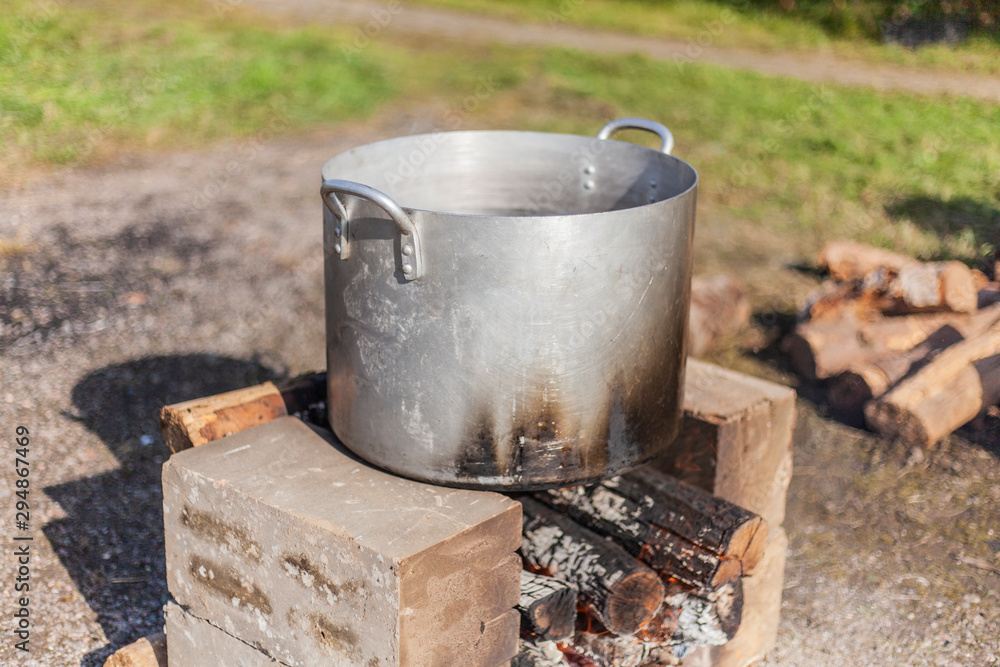 The pan is on fire. Cooking on the street. Water is heated at the stake. How to cook a lot of food. The pan is on fire. Cooking on the street. Water is heated at the stake. How to cook a lot of food.