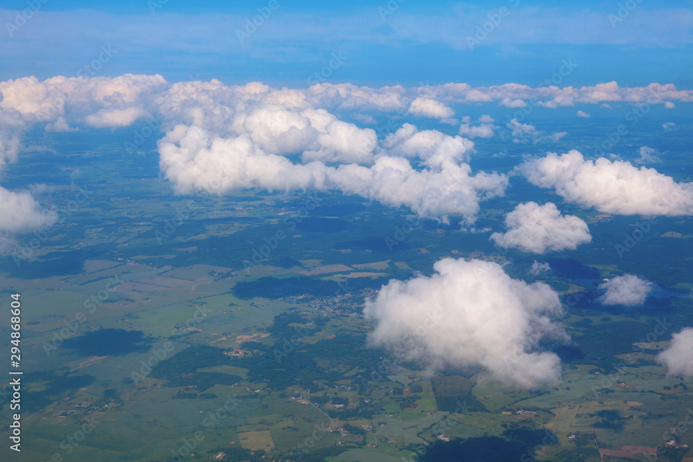 aerial scenery with flying clouds above the earth