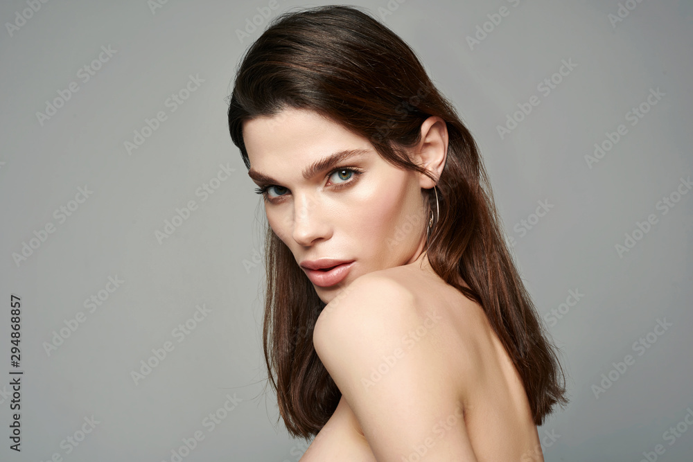 Glamour portrait of beautiful brunette woman model with fresh daily makeup and romantic hairstyle. Fashion shiny highlighter on skin, sexy gloss lips make-up and dark eyebrows. Glamour portrait of beautiful brunette woman model with fresh daily makeup and romantic hairstyle. Fashion shiny highlighter on skin, sexy gloss lips make-up and dark eyebrows.