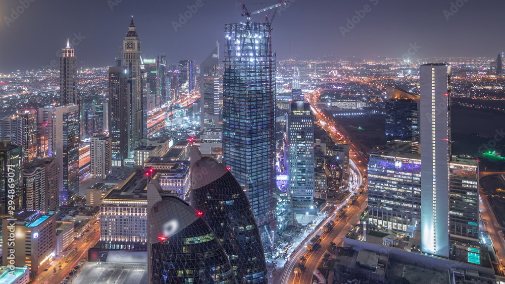 Skyline of the buildings of Sheikh Zayed Road and DIFC aerial night timelapse in Dubai, UAE. Skyline of the buildings of Sheikh Zayed Road and DIFC aerial night timelapse in Dubai, UAE.