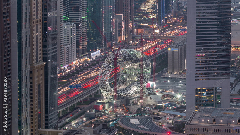 Construction site of the Museum of the Future aerial day to night timelapse, next iconic building of Dubai. Construction site of the Museum of the Future aerial day to night timelapse, next iconic building of Dubai.