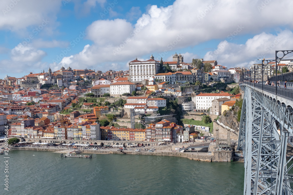 View of the historical city of Porto across the Douro River alongside the Ponte Luiz, bridge