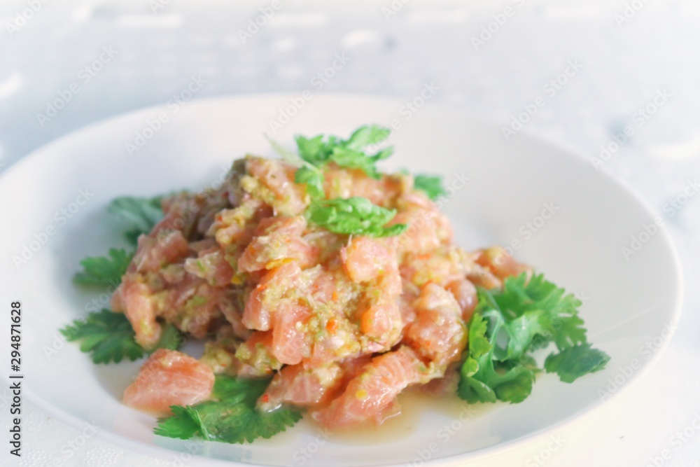 Spicy salmon in Thai seafood style