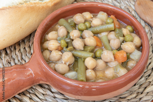 Cazuela de barro de garbanzos y verduras photo