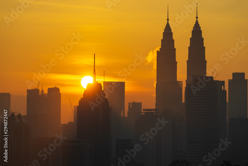 KUALA LUMPUR  MALAYSIA - 5th OCT 2019  Majestic sunrise over downtown Kuala Lumpur. It s modern skyline is dominated by 451m tall KLCC  a pair of glass-and-steel-clad skyscrapers with Islamic motif.