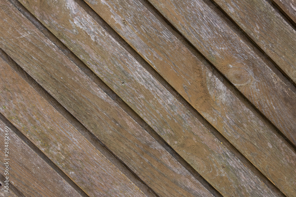 Obraz premium old vintage fence made of brown wooden planks