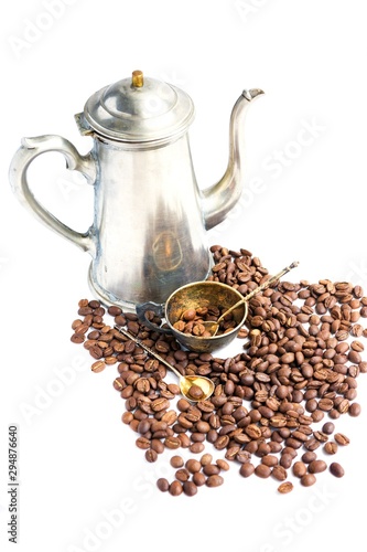 Coffee beans, antique cup and cofeepot on white