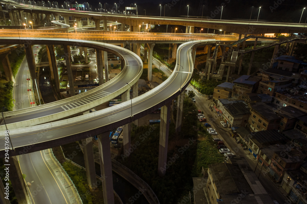 Naklejka premium aerial view of buildings and highway interchange in dawn in Guiyang, China