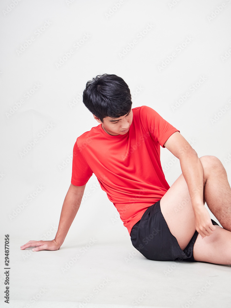 Young man sports player stretching and exercising Young man sports player stretching and exercising