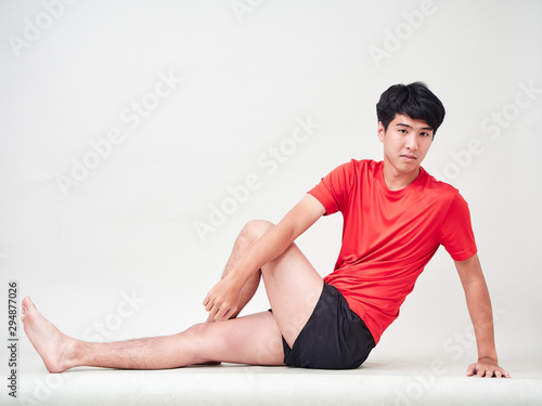 Young man sports player stretching and exercising