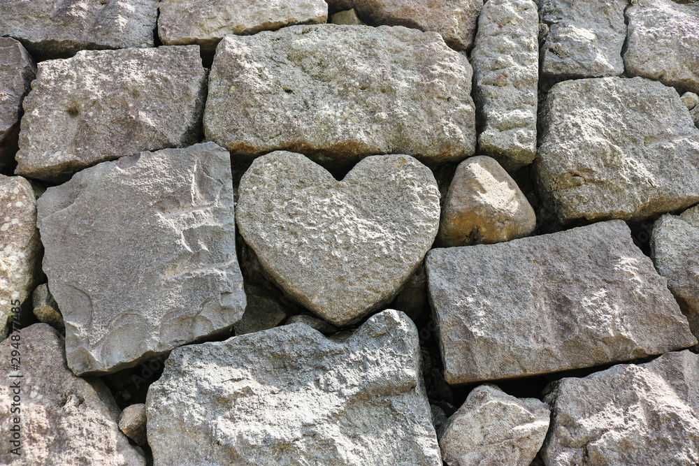 The heart-shaped rock on wall stone at Meganebashi Brigde in Nagasaki,  Japan Photos