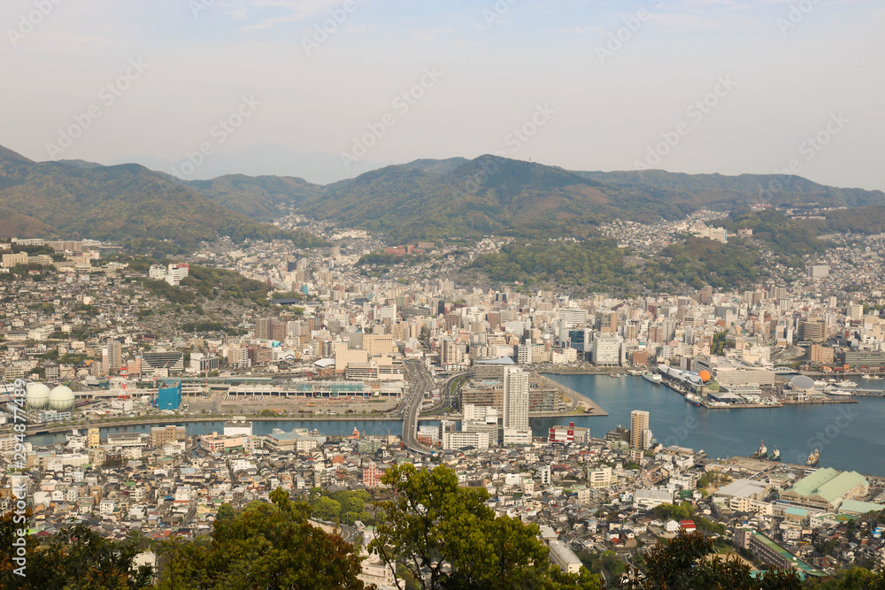 Landscape view of top Mount Inasa in sunny day with Nagasaki city and blue sky and mountain
