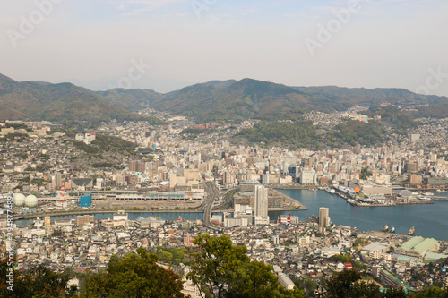 Landscape view of top Mount Inasa in sunny day with Nagasaki city and blue sky and mountain