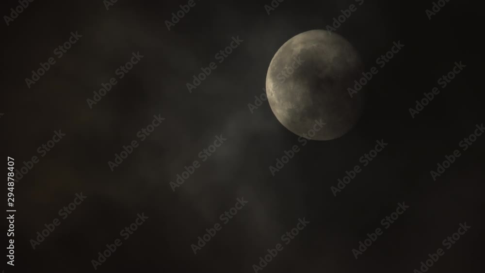 Detailed almost full moon close up behind dark eerie slow moving clouds.mov Detailed almost full moon close up behind dark eerie slow moving clouds.mov